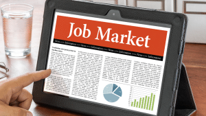 A tablet showing the latest job market forecast