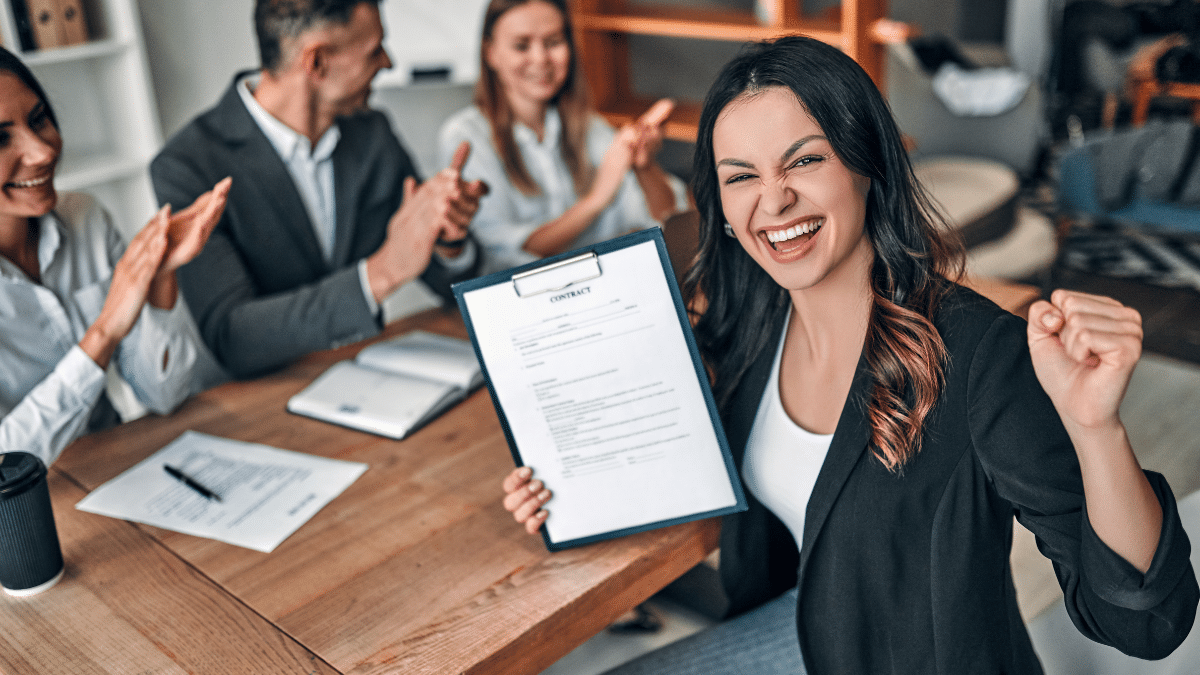A woman feeling satisfied by her career accomplishment