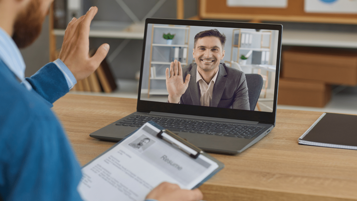A man having a virtual meeting while working remotely