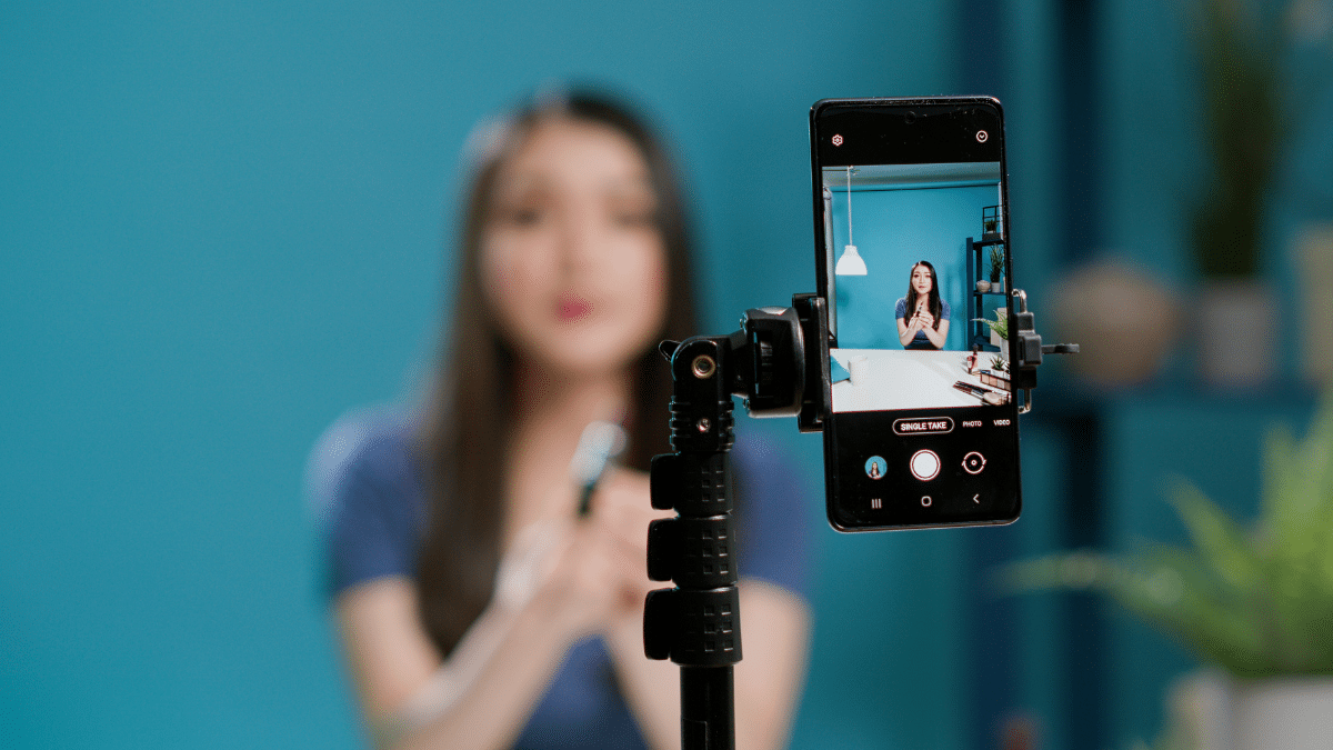 A female content creator filming a video for social media